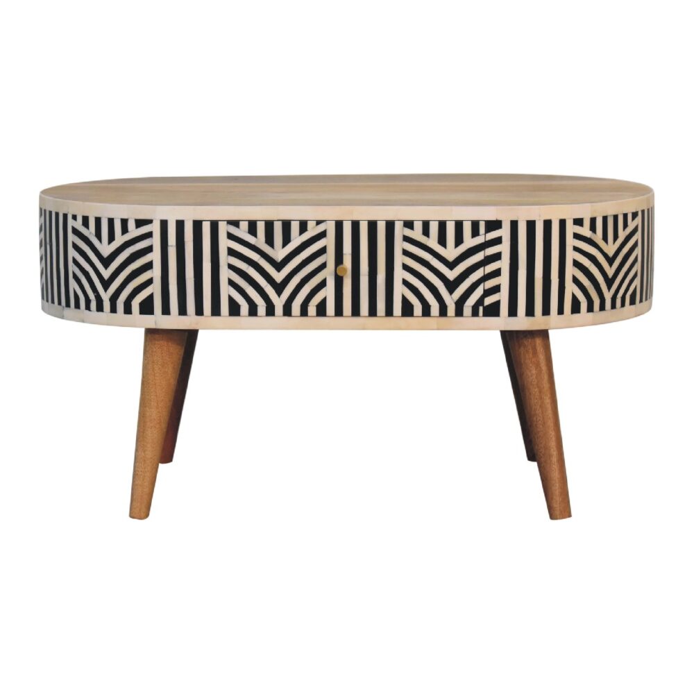 Geometric pattern coffee table with tapered wooden legs.