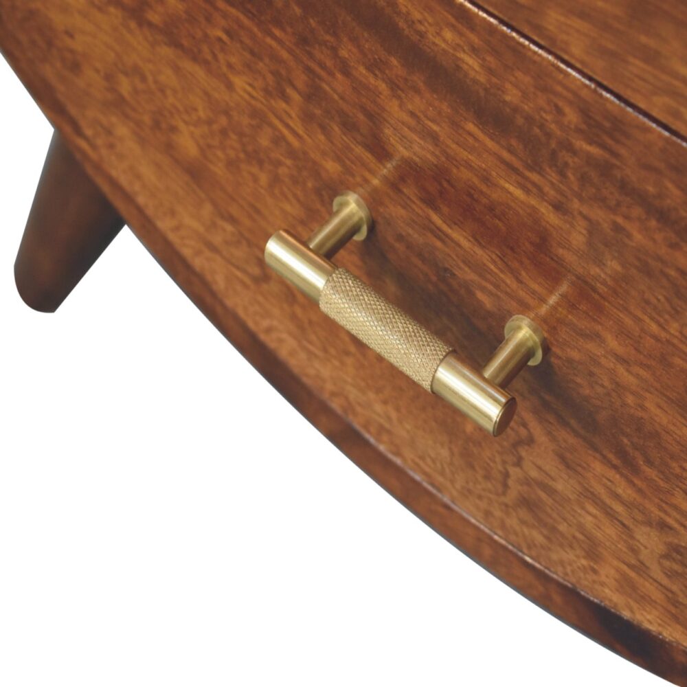 Wooden drawer with brass handle detail