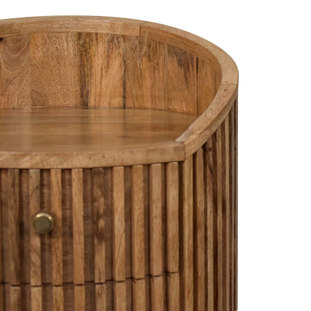 Round wooden side table with textured finish.