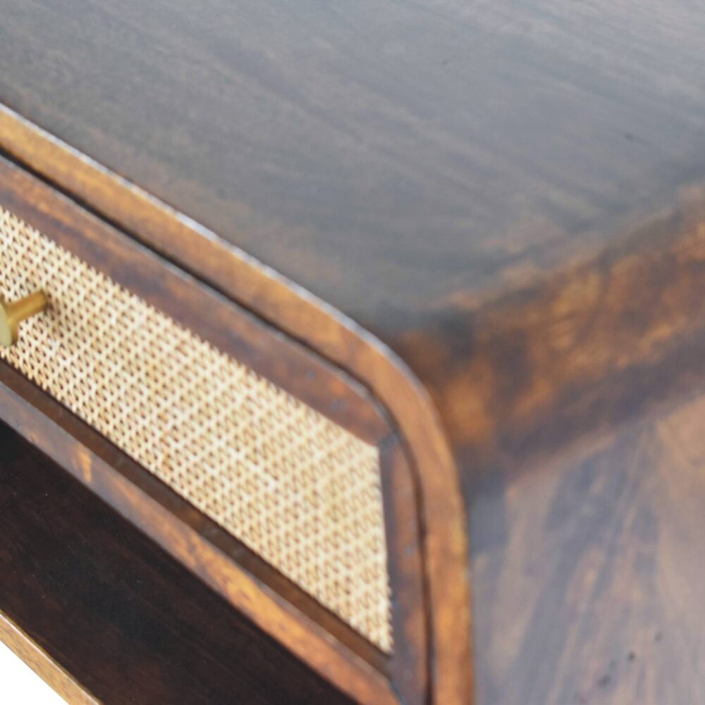 Close-up of dark wood furniture with woven detail.